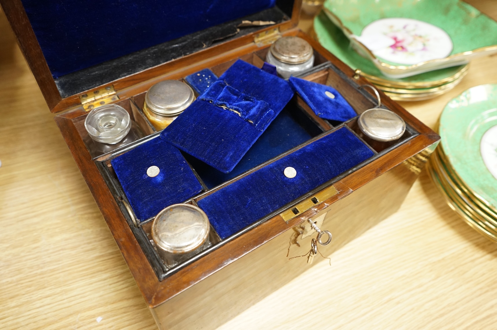 A 19th century walnut toilet box, fitted with glass and plate topped fittings, 27.5cm wide x 17cm high